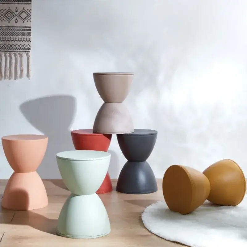Multicolored minimalist creative stools in a modern interior setting with a clean design.